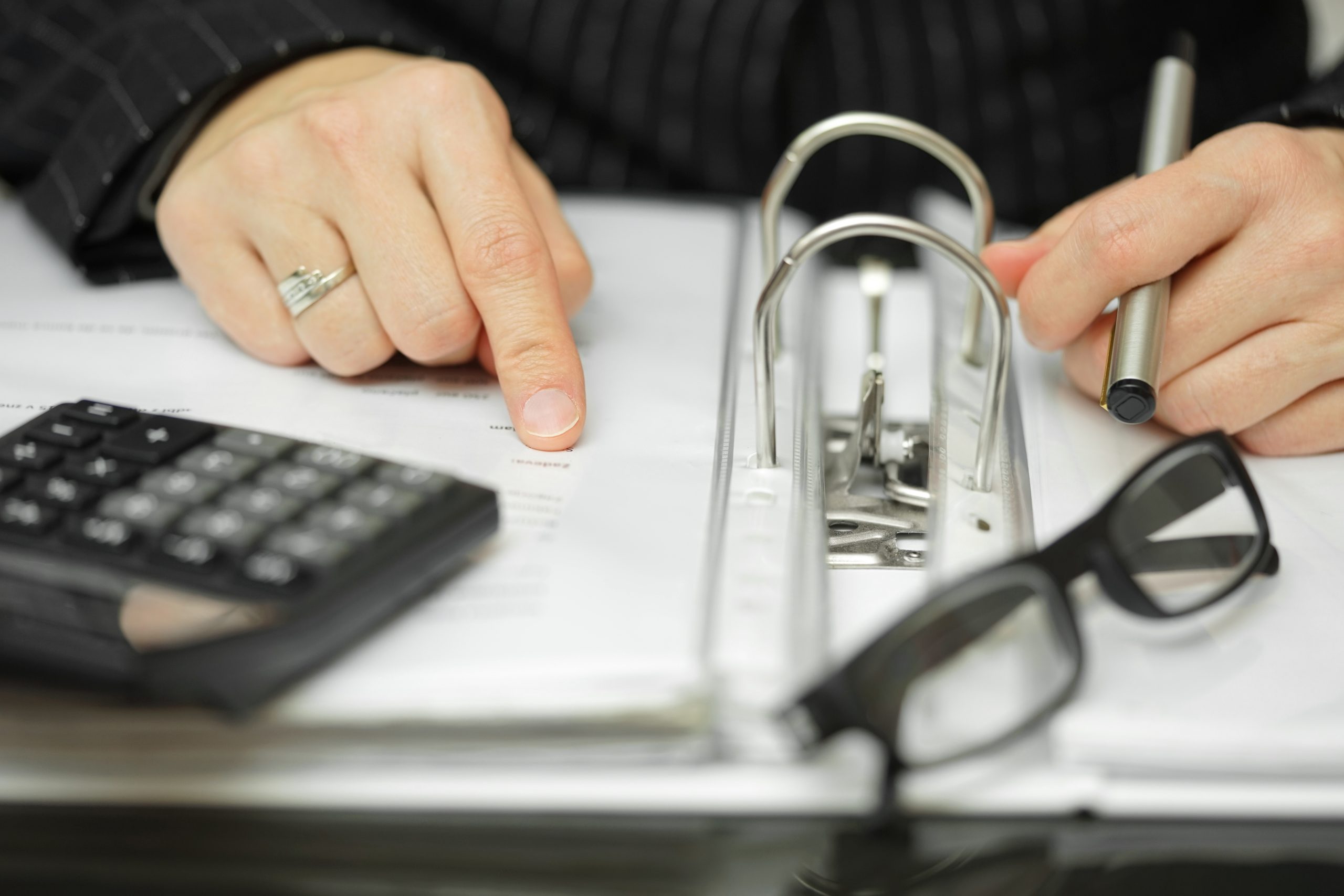 Closeup Of Businesswoman Hands analyzing financial data